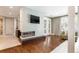 Relaxing main bedroom features a modern fireplace, hardwood floors, and large windows at 295 Jersey St, Denver, CO 80220