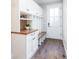 Well-organized mudroom features custom cabinets, shelving, and a convenient bench, perfect for storage at 295 Jersey St, Denver, CO 80220