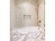 Close-up of a luxurious shower with custom tile work and elegant fixtures at 295 Jersey St, Denver, CO 80220