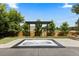 Landscaped backyard featuring a built-in jacuzzi, pergola, wooden fence, and lush greenery for outdoor enjoyment at 9161 W Lake Dr, Littleton, CO 80123