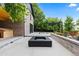 Beautiful backyard with jacuzzi, fire pit, and modern brick planter, perfect for relaxation and outdoor entertaining at 9161 W Lake Dr, Littleton, CO 80123