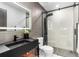 Sleek bathroom with a glass-enclosed shower, modern fixtures, and elegant tiling for a spa-like experience at 9161 W Lake Dr, Littleton, CO 80123