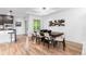 Contemporary dining area with bar seating area and modern light fixture at 9161 W Lake Dr, Littleton, CO 80123