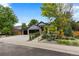 Beautiful house exterior with a two-car garage and well-manicured front yard at 9161 W Lake Dr, Littleton, CO 80123