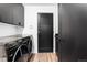 Sleek laundry room featuring modern appliances and contemporary design elements at 9161 W Lake Dr, Littleton, CO 80123