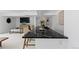 Living room with bar featuring a sleek countertop, modern decor, comfortable seating, and stylish contemporary art at 9161 W Lake Dr, Littleton, CO 80123