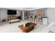 Spacious living room with a bar, modern decor, comfortable seating, TV, and art for relaxation and entertainment at 9161 W Lake Dr, Littleton, CO 80123