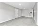 Spacious basement featuring neutral carpet, white trim, and multiple doorways for easy access at 4625 Webster St, Wheat Ridge, CO 80033