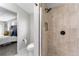 Tiled shower with a rainfall shower head and a modern design at 4625 Webster St, Wheat Ridge, CO 80033