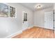 Bedroom featuring wood floors, natural light, and closet storage at 4625 Webster St, Wheat Ridge, CO 80033