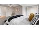 Neutral bedroom featuring a ceiling fan, carpeted floors and sliding door closet at 4625 Webster St, Wheat Ridge, CO 80033