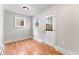 Bedroom featuring wood floors, neutral paint, and natural light from the backyard window at 4625 Webster St, Wheat Ridge, CO 80033