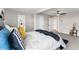 Neutral bedroom featuring a ceiling fan, carpeted floors and a small side table at 4625 Webster St, Wheat Ridge, CO 80033