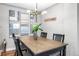 Dining room with an artful chandelier, wooden table, and decorative artwork at 4625 Webster St, Wheat Ridge, CO 80033