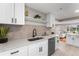 Bright kitchen with new stainless steel appliances, white countertops and cabinets at 4625 Webster St, Wheat Ridge, CO 80033