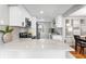 Well-lit kitchen with stainless steel appliances, white cabinets, and decorative accents at 4625 Webster St, Wheat Ridge, CO 80033