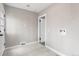 Laundry room featuring white tile flooring, modern paint, and washer and dryer hookups at 4625 Webster St, Wheat Ridge, CO 80033