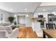 Open concept living and kitchen area with hardwood floors and modern cabinets at 4625 Webster St, Wheat Ridge, CO 80033