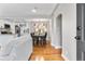 Open concept space shows kitchen, dining and living area with hardwood flooring and lots of natural light at 4625 Webster St, Wheat Ridge, CO 80033
