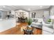 Open concept living, dining and kitchen featuring neutral decor and hardwood floors at 4625 Webster St, Wheat Ridge, CO 80033