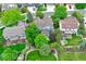 Stunning aerial of the property showcasing a lush backyard, mature trees, and a manicured neighborhood at 8927 Green Meadows Ln, Highlands Ranch, CO 80126
