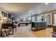 Spacious basement includes games table, fireplace, bar, and stainless steel refrigerator at 8927 Green Meadows Ln, Highlands Ranch, CO 80126