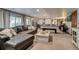 Spacious basement with large sectional sofa, games table, wet bar, and plenty of room to entertain at 8927 Green Meadows Ln, Highlands Ranch, CO 80126