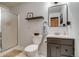 Modern bathroom features a shower, toilet, vanity with sink, and a sleek mirror at 8927 Green Meadows Ln, Highlands Ranch, CO 80126