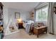 Light and bright bedroom with reading nook, charming decor, and large window for ample natural light at 8927 Green Meadows Ln, Highlands Ranch, CO 80126