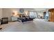 Large main bedroom with a cozy sitting area, a large bay window, and ensuite bath at 8927 Green Meadows Ln, Highlands Ranch, CO 80126