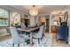 Formal dining room featuring elegant chairs, a stylish chandelier, and an inviting atmosphere at 8927 Green Meadows Ln, Highlands Ranch, CO 80126