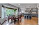 Eat-in kitchen with stainless appliances, granite countertops, island, and large windows at 8927 Green Meadows Ln, Highlands Ranch, CO 80126
