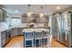 Modern kitchen with stainless steel appliances, a kitchen island, and ample cabinet space at 8927 Green Meadows Ln, Highlands Ranch, CO 80126