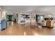 Open living area with fireplace, built-in shelving, and lots of natural light at 8927 Green Meadows Ln, Highlands Ranch, CO 80126