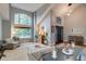 Elegant living room boasts soaring ceilings, an arched window, and stylish furnishings at 8927 Green Meadows Ln, Highlands Ranch, CO 80126