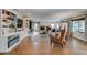 Spacious living room with fireplace, built-in bookshelves, and large windows at 8927 Green Meadows Ln, Highlands Ranch, CO 80126