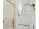 Bright bathroom featuring white cabinets, shower with glass doors and neutral decor at 865 Delaware St, Denver, CO 80204
