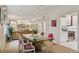 The dining room has a glass table, with an open view to the kitchen and living room at 865 Delaware St, Denver, CO 80204