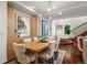 Elegant dining room with hardwood floors, chandelier, adjacent to the staircase and built-in storage at 865 Delaware St, Denver, CO 80204