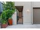 Inviting front gate with lush greenery, enhancing curb appeal and privacy at 865 Delaware St, Denver, CO 80204