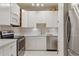 Modern kitchen with stainless steel appliances and ample white cabinetry at 865 Delaware St, Denver, CO 80204