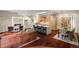 Spacious living room with a fireplace, open kitchen, dining area and hardwood floors at 865 Delaware St, Denver, CO 80204