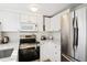 Well-equipped kitchen featuring stainless steel appliances and a sleek, modern design at 5959 S Willow Way, Greenwood Village, CO 80111