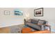 Cozy living room featuring a comfortable sofa, modern decor, and a stylish rug at 5959 S Willow Way, Greenwood Village, CO 80111