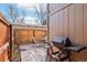 Enclosed patio with outdoor furniture and grill, offering a private outdoor space for relaxation and entertaining at 5959 S Willow Way, Greenwood Village, CO 80111