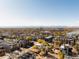 Wide angle aerial view of a neighborhood featuring a lake and mountain range in the distance at 3437 W 17Th Ave, Denver, CO 80204