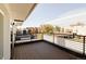 Outdoor balcony with sleek black railings and views of the neighborhood at 3437 W 17Th Ave, Denver, CO 80204