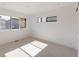 Bright and airy bedroom with neutral carpet, white walls and two modern horizontal windows at 3437 W 17Th Ave, Denver, CO 80204