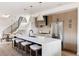 Bright, modern kitchen with stainless steel appliances and a large white marble countertop island with seating at 3437 W 17Th Ave, Denver, CO 80204