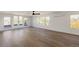 Expansive living room featuring hardwood floors, recessed lighting, and access to an outdoor deck at 3437 W 17Th Ave, Denver, CO 80204